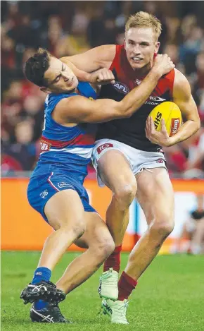  ?? ARM WRESTLE: Melbourne's Bernie Vince tries to get away from the tackle of Western Bulldogs’ Luke Dahlhaus. Picture: GEORGE SALPIGTIDI­S ??