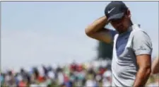  ?? THE ASSOCIATED PRESS ?? Jason Day, of Australia, looks down on the ninth hole during Friday’s second round of the U.S. Open.