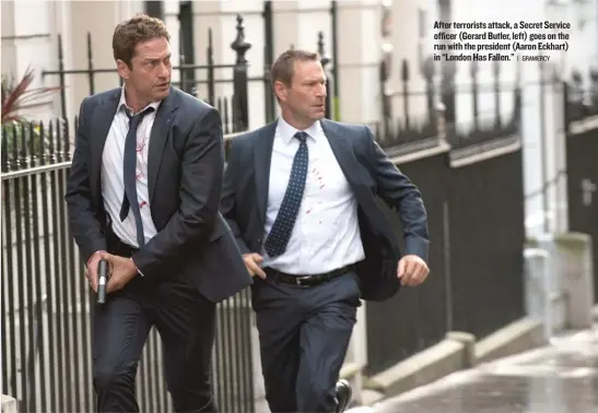  ?? | GRAMERCY ?? After terrorists attack, a Secret Service officer (Gerard Butler, left) goes on the run with the president (Aaron Eckhart) in “London Has Fallen.”
