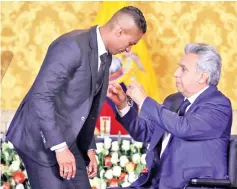  ?? - AFP photo ?? Ecuadorean President Lenin Moreno (R) decorates ex-Manchester United Ecuadorean footballer Luis Antonio Valencia with the National Order of Merit for his profession­al sport career, at Carondelet Presidenti­al Palace in Quito on May 14, 2019.