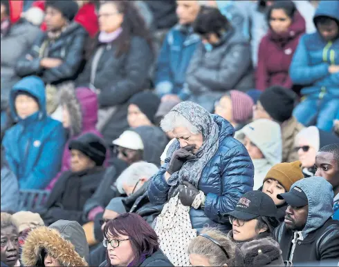  ?? RICHARD LAUTENS/TORONTO STAR ?? After a march along Yonge St., thousands gathered in Mel Lastman Square on Sunday night to mourn the victims of last week’s deadly van rampage.