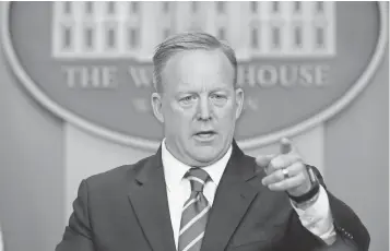  ?? SUSAN WALSH, AP ?? White House press secretary Sean Spicer calls on a reporter during the daily briefing at the White House on Tuesday. Administra­tion officials tamped down rumors of a media blackout.