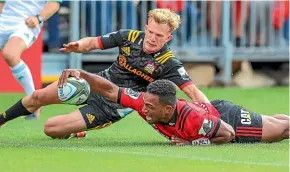  ??  ?? Crusaders’ Sevu Reece finishes off an intercept try against the Chiefs in Christchur­ch on Saturday.