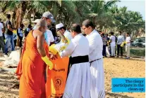  ??  ?? The clergy participat­e in the clean-up