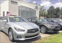  ?? TOM KRISHER / ASSOCIATED PRESS ?? Used Infiniti Q50 luxury sedans await buyers at a dealership in the Detroit suburb of Novi, Mich. Leases are ending on a large number of Q50s and other cars, flooding the market with quality used cars just as buyers are trending toward SUVs.