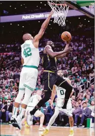  ?? Carlos Avila Gonzalez / Associated Press ?? The Warriors’ Draymond Green tries to get past the Celtics’ Al Horford during Game 4 of the NBA Finals on Friday in Boston.