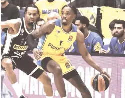  ?? (Dov Halickman) ?? ANTONIUS CLEVELAND (1) moved from Hapoel Eilat to Maccabi Tel Aviv over the summer and is primed to be an impact player, especially the defensive end.