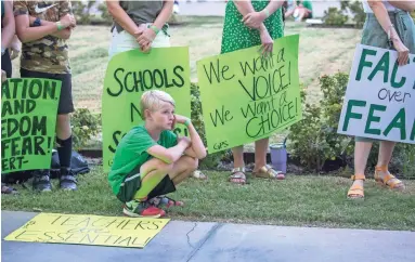  ?? NICK OZA/THE REPUBLIC ?? Grayson Bair, 9, from Highland Park Elementary attends the AZ Open Our School Rally with his family at the State Capitol, advocating for in-person learning options for families and educators who want to be in the classroom.