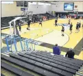  ?? TERRANCE WILLIAMS/AP ?? Yeshiva players warm up in front of an empty stands Friday at Johns Hopkins.