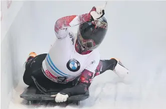  ?? KERSTIN JOENSSON/ THE ASSOCIATED PRESS ?? Calgary’s Elisabeth Vathje celebrates in the finish area after winning a silver medal at the World Cup skeleton race in Innsbruck, Austria, Friday.