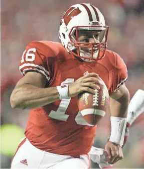  ?? MARY LANGENFELD/USA TODAY SPORTS ?? Grad transfer Russell Wilson left North Carolina State for Wisconsin, where he had 33 TD passes and seven other TDs.