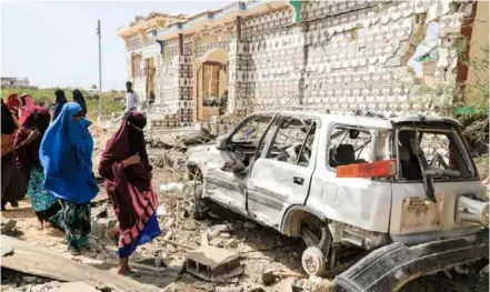  ?? AFP/VNA Photo ?? A house destroyed when Al-shabaab militants attacked a police station on the outskirts of Mogadishu, Somalia. US President Joe Biden has ordered the reestablis­hment of a US troop presence in Somalia to help local authoritie­s combat the Al-shabaab militant group.