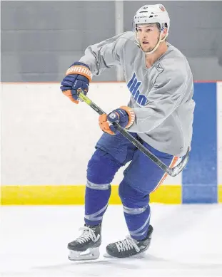  ?? JASON MALLOY/THE GUARDIAN ?? Ross Johnston is motivated to earn his spot with the New York Islanders as the on-ice component of training camp begins today. He skated with other Island pros, university and major junior players this summer in Pownal.