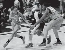  ?? SEAN D. ELLIOT/THE DAY ?? Connecticu­t Sun players Jasmine Thomas, left, and Shekinna Stricklen pressure Washington’s Emma Meesseman in Game 4 of the WNBA Finals at Mohegan Sun Arena on Oct. 8, 2019.
