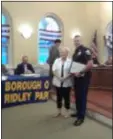  ?? SUBMITTED PHOTO ?? Patrolman Thomas Byrne Jr., right, greets Joan McIntosh, whose life he helped save, during a recent Ridley Park Borough Council meeting.