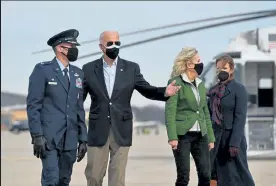  ?? Mandel Ngan / Getty Images ?? President Joe Biden, middle left, and First Lady Jill Biden, middle right, are greeted by Colonel Stephen P. Snelson, left, and his wife, Catherine Snelson, as the Bidens arrive Friday to board Air Force One at Joint Base Andrews in Maryland. President Biden told Iran “You can’t act with impunity. Be careful,” following his approval of airstrikes targeting facilities the U.S. alleges are used by Iran-backed militants.