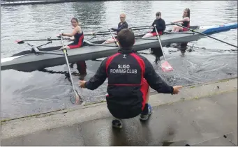  ??  ?? Sligo Rowing Club’s Neasa Henehan , Anya Raftery, Siofra Kellegher, Erin O’Connor with coach Glenn Patterson on slip at the Carrick-on-Shannon regatta.