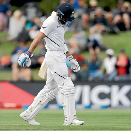  ?? AP ?? Virat Kohli walks off Hagley Oval after another cheap dismissal as New Zealand took control of the second test.