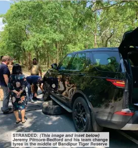  ??  ?? STRANDED: (This image and inset below) Jeremy Pilmore-Bedford and his team change tyres in the middle of Bandipur Tiger Reserve