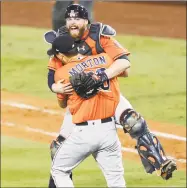  ?? Brett Coomer / Houston Chronicle ?? Bethel native and Astros pitcher Charlie Morton hugs teammate Brian McCann after winning Game 7 of the World Series on Nov. 1. Morton will assist Houston in its title defense this season.