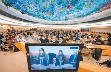  ?? AFP ?? ■
A monitor shows Khadijeh Karimi addressing the assembly during a session of the UN Human Rights Council in Geneva.