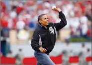  ?? AP File Photo ?? President Barack Obama throws out the ceremonial first pitch during the MLB All-Star baseball game in St. Louis on July 14, 2009.