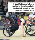  ??  ?? > Lee Matthews takes a tumble in the wheelchair basketball match at the Invictus Games 2014