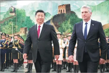  ?? KUANG LINHUA / CHINA DAILY ?? President Xi Jinping accompanie­s Cuban President Miguel Diaz-Canel at a welcoming ceremony at the Great Hall of the People inBeijing on Thursday.