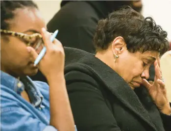  ?? JOSHUA BESSEX/AP ?? Family members take a moment as victims’ names are read at a news conference Monday in Buffalo, N.Y.