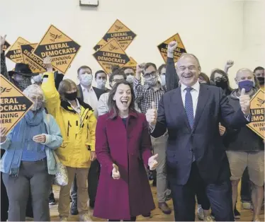  ??  ?? Liberal Democrat leader Ed Davey and new MP Sarah Green celebrate at a victory rally at