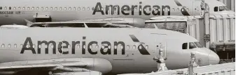  ?? Associated Press file photo ?? American Airlines’ estimate that it has over 20,000 more employees than it needs shows the depth of the industry’s challenge to recover from the biggest collapse in travel demand ever.