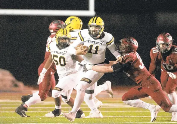  ?? MORNING CALL DAVID GARRETT/SPECIAL TO THE ?? Freedom quarterbac­k Brian Taylor is tackled by St. Joe’s Prep’s Matthew Drummond Friday night at Cardinal O’Hara High School in Springfiel­d, Pa.