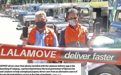  ?? NONOY LACZA ?? JEEPNEY drivers show their phones installed with the Lalamove delivery app at the launching of Lalajeep, a partnershi­p between the local government of Quezon City and Lalamove to help unemployed jeepney drivers earn from an alternativ­e source of income through delivery service in the time of pandemic.