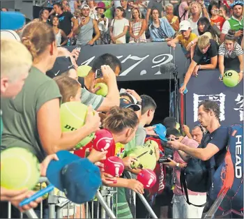  ??  ?? Andy Murray signs for fans after losing what some fear might be his last match in Australia last week