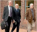  ??  ?? Michael Kidd, centre, arrives at the High Court in Auckland in 2015, flanked by his legal team.