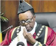  ?? ?? Councillor Joel Williams of the Denbigh Division in Clarendon wipes away tears as he makes his first speech as mayor of May Pen during the swearing in of councillor­s of the Clarendon Municipal Corporatio­n in the parish capital on Thursday.