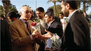  ?? (Ibraheem Abu Mustafa/Reuters) ?? HAMAS LAWMAKERS welcome MP Gerald Kaufman upon his arrival at the Rafah border crossing in the southern Gaza Strip in 2010.