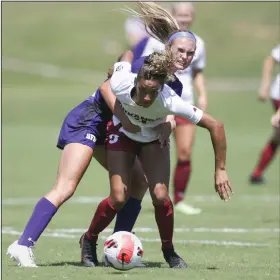  ?? (NWA Democrat-Gazette/Charlie Kaijo) ?? Arkansas forward Kiley Dulaney (front) and Stephen F. Austin defender Macie Johnson fight for possession of the ball Monday at Razorback Field in Fayettevil­le. The Razorbacks won 6-1 to improve to 2-2.