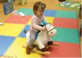  ??  ?? Madalyn Deboer, 2, tests out the B. Rodeo Rocker.