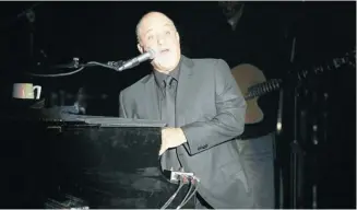  ?? Donald Traill/invision/ap Photo ?? Billy Joel performs in his native Long Island after a long hiatus from singing live on stage.