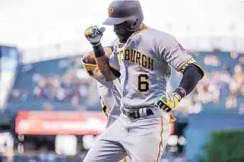  ?? JACK DEMPSEY/ASSOCIATED PRESS ?? Starling Marte celebrates his first-inning homer at Colorado that helped launch the Pirates to a 10-2 victory over the Rockies.