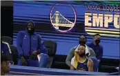  ?? JEFF CHIU — THE ASSOCIATED PRESS ?? Warriors forward Draymond Green, left, and Stephen Curry react on the bench during a game against the Los Angeles Lakers in San Francisco on March 15.