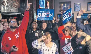  ??  ?? KEEPING THE FAITH: Supporters of former vice-president Joe Biden, a Democratic presidenti­al hopeful, cheer in Detroit last week. Mr Biden’s performanc­e in Michigan suggest Mr Trump may struggle to replicate his 2016 success in the crucial swing state.