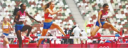 ?? LINDSEY WASSON / REUTERS ?? Dalilah Muhammad of the United States, Femke Bol of the Netherland­s and Sydney Mclaughlin of the
U.S. run the final in the 400-metre hurdles. Respective­ly, they won silver, bronze and gold.