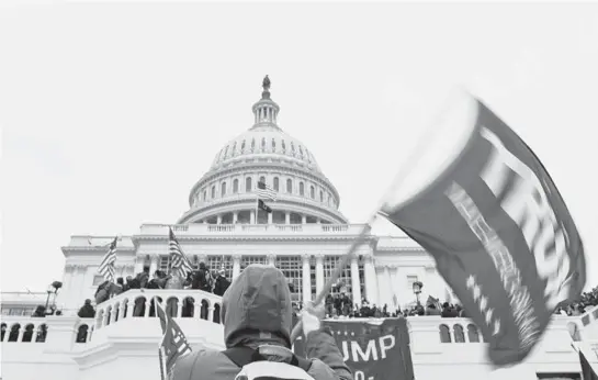  ?? KENNY HOLSTON/THE NEW YORK TIMES ?? Trump supporters storm the U.S. Capitol. The lies, white nationalis­m and baseless conspiracy theories the president has long peddled are ingrained in the party.