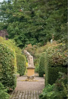  ??  ?? Above: Statue reputed to be of Robert Brown in the heart of the garden.