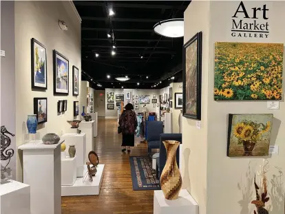  ?? Mary Ann Anderson/TNS ?? ■ The Art Market Gallery, a regional cooperativ­e featuring original art and fine crafts, is on busy Gay Street in downtown Knoxville. Many of the artists represente­d at the gallery teach art to adults and children.