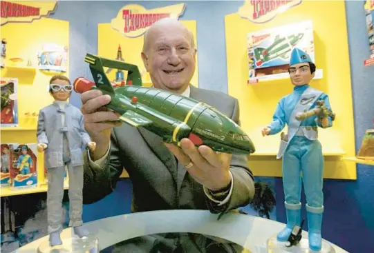  ?? HUGO PHILPOT/AP ?? Gerry Anderson poses with a toy Thunderbir­d 2 in 2005 in London on the 40th anniversar­y of the Thunderbir­ds first broadcast.