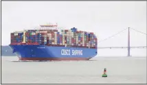  ?? (AP) ?? In this file photo, a Cosco Shipping container ship passes the Golden Gate Bridge in San Francisco bound for the Port of Oakland. For major shipping companies dealing with trade wars and a slowing global growth, conditions
appear to have deteriorat­ed as 2019 came to a close.