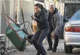  ?? Alan Markfield / Sony Pictures ?? Naomie Harris portrays a rookie New Orleans police officer being pursued by bad cops as well as a drug dealer, while Tyrese Gibson plays her reluctant friend from childhood in the taut thriller “Black and Blue.”